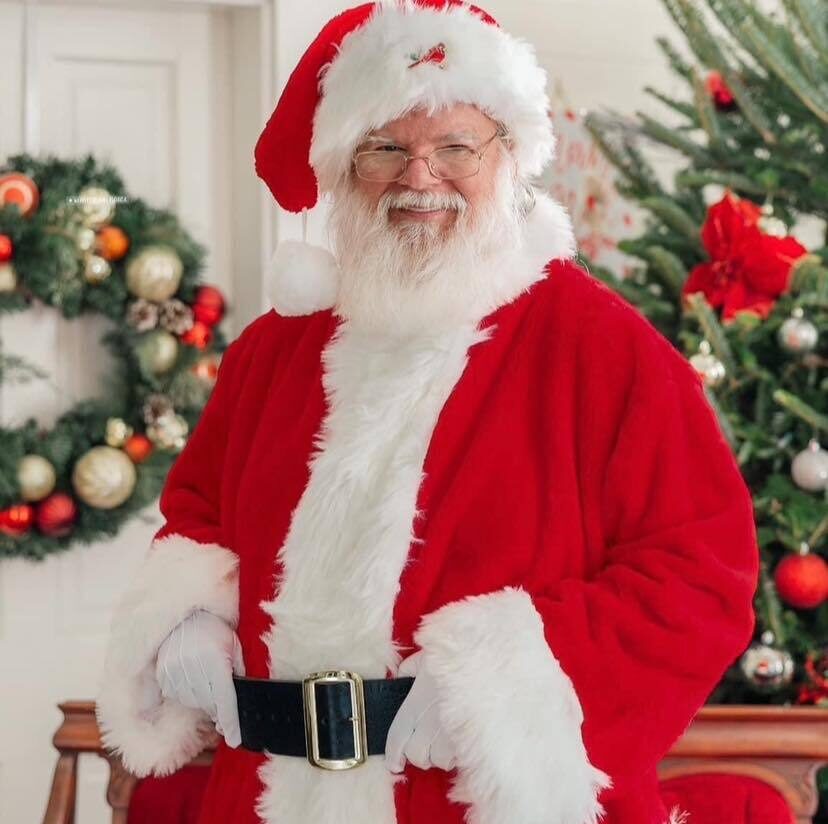 Professional Santa Claus performer at a holiday party booked through ImSanta