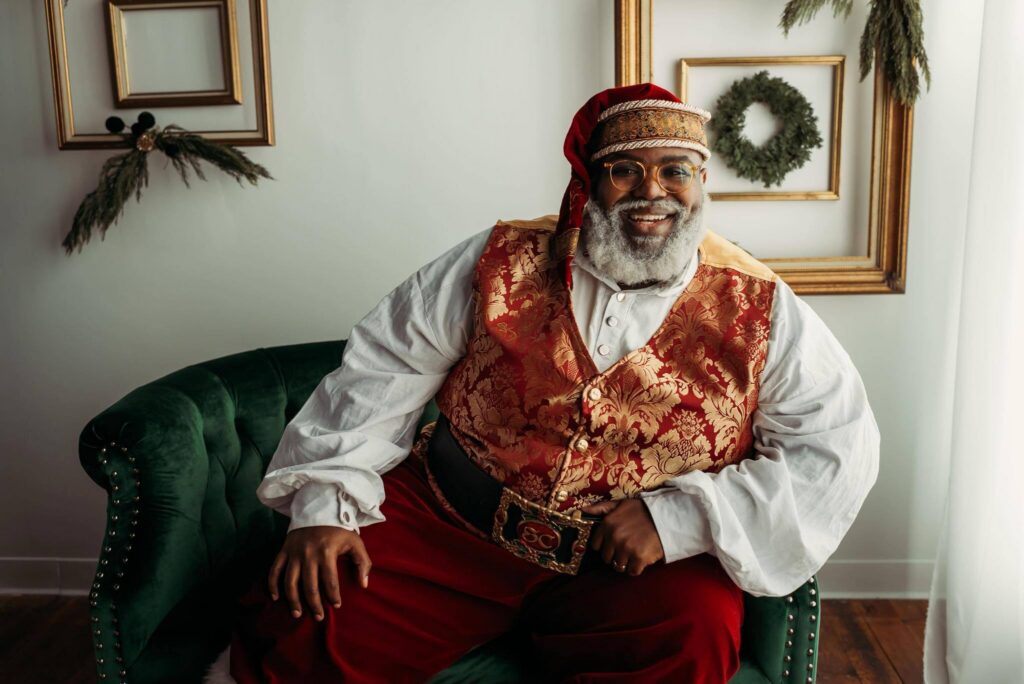 Professional Santa Claus seated at a holiday event for ImSanta client reviews